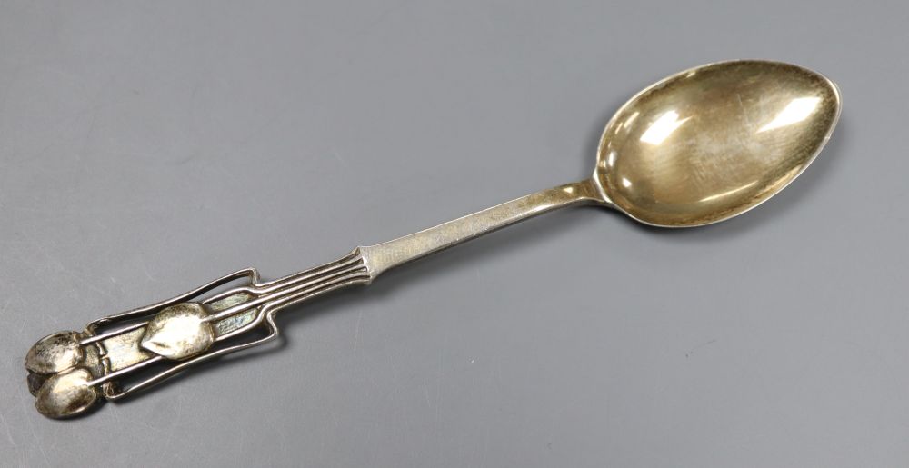 An Edwardian Art Nouveau Liberty & Co Cymric silver coffee spoon, with stylised terminal, Birmingham, 1904, 11cm, 12.5 grams.